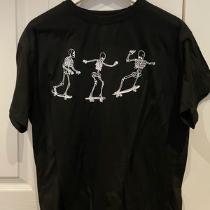 black tee with skeletons skate boarding